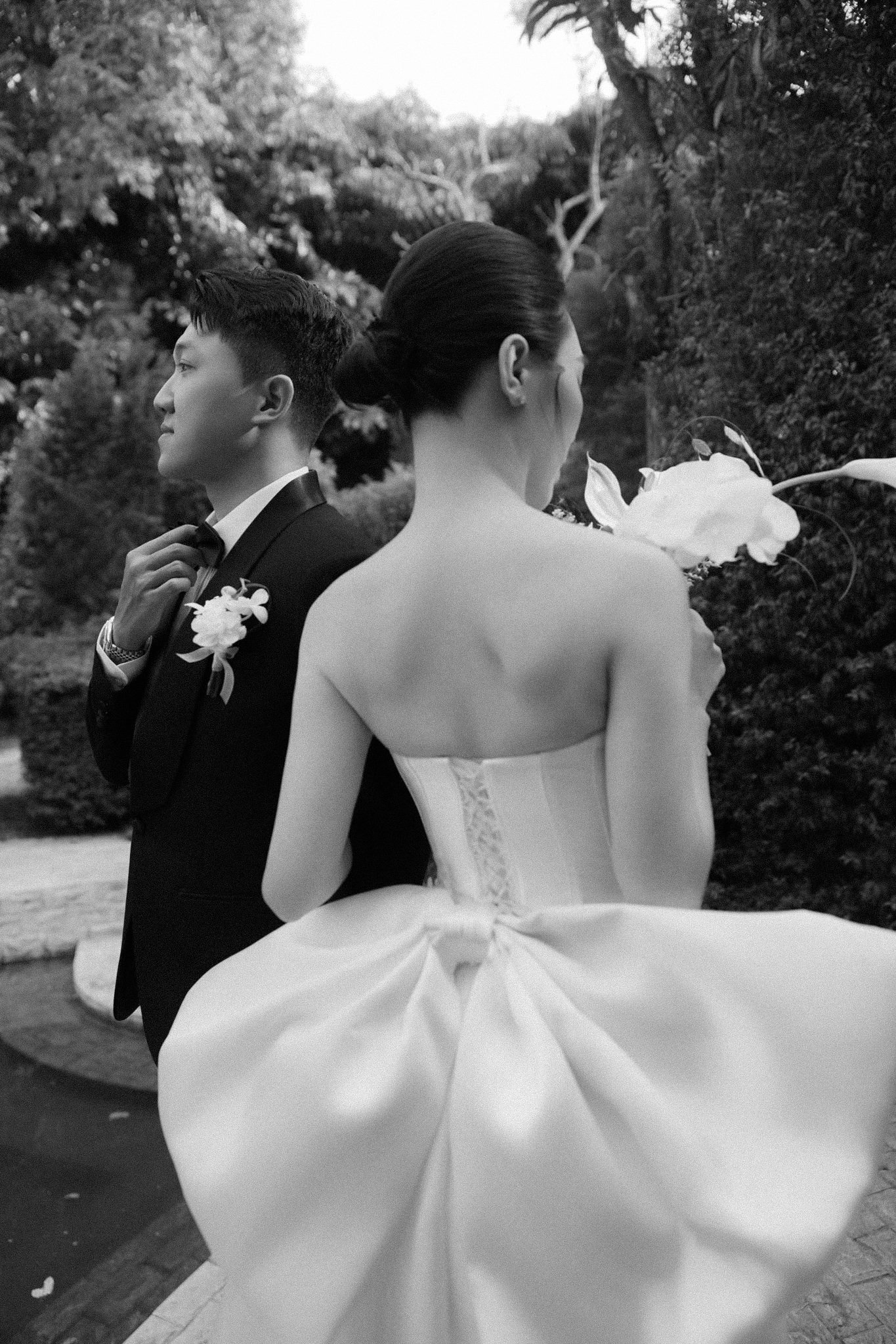 Hậu and Hân in a garden, black and white